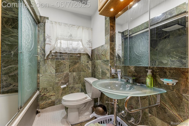 8786 N Evangeline St, Dearborn Heights, MI 48127 - bathroom with tile walls, bath / shower combo with glass door, and toilet
