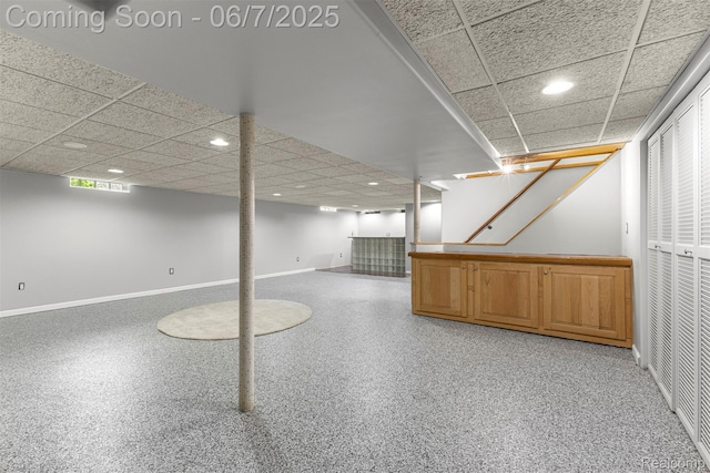 8786 N Evangeline St, Dearborn Heights, MI 48127 - below grade area featuring baseboards, a drop ceiling, and recessed lighting