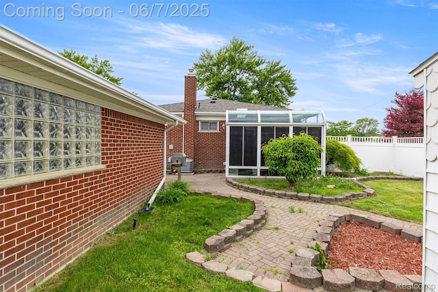 8786 N Evangeline St, Dearborn Heights, MI 48127 - view of yard with a sunroom and a patio
