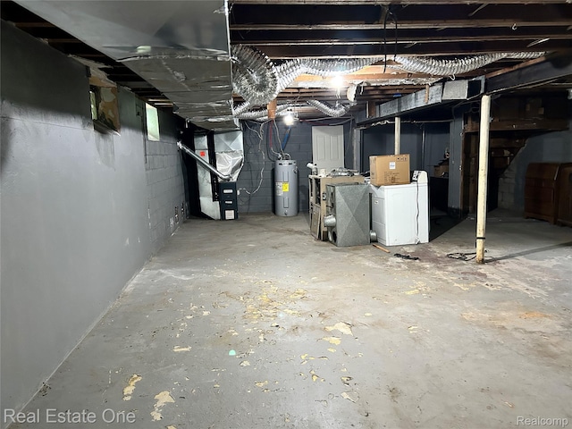 16857 Cheyenne St, Detroit, MI 48235 - unfinished basement featuring heating unit, water heater, washer / clothes dryer, and concrete block wall