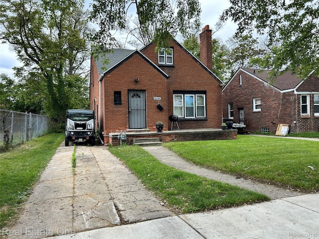 16857 Cheyenne St, Detroit, MI 48235 - bungalow-style home featuring a chimney, brick siding, and driveway