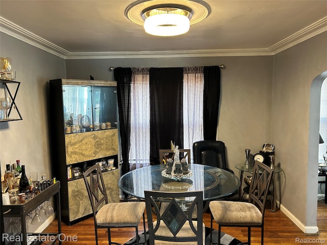16857 Cheyenne St, Detroit, MI 48235 - dining space featuring arched walkways, wood finished floors, and ornamental molding