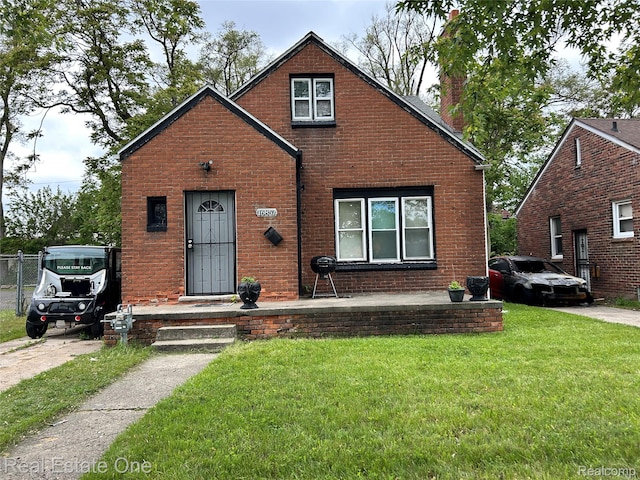 16857 Cheyenne St, Detroit, MI 48235 - bungalow-style home featuring a front yard, brick siding, and a chimney