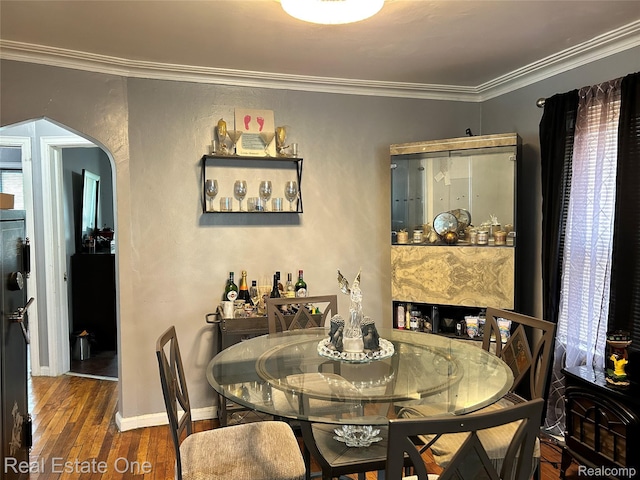 16857 Cheyenne St, Detroit, MI 48235 - dining room featuring crown molding, hardwood / wood-style flooring, and arched walkways