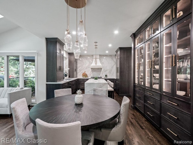 4087 Araby Ct, Highland, MI 48356 - dining space featuring dark wood-style flooring, vaulted ceiling, and recessed lighting