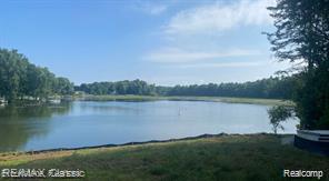 4087 Araby Ct, Highland, MI 48356 - water view with a heavily wooded area