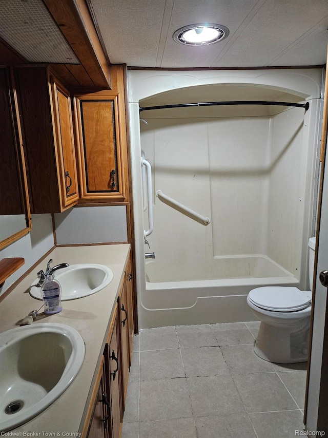 2270 Gulfstream St, Brighton, MI 48114 - full bathroom featuring toilet, washtub / shower combination, double vanity, and tile patterned flooring