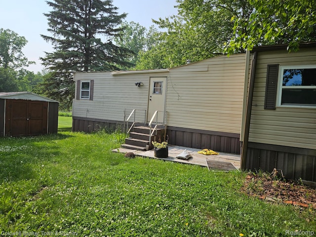 2270 Gulfstream St, Brighton, MI 48114 - rear view of property featuring a yard