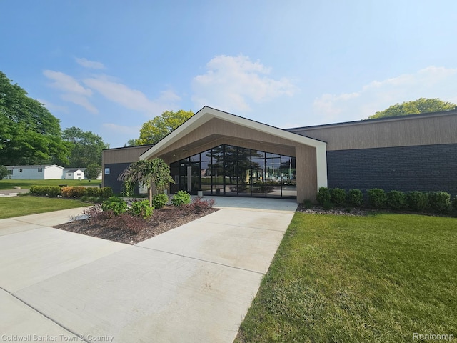 2270 Gulfstream St, Brighton, MI 48114 - view of home's community with a yard and concrete driveway