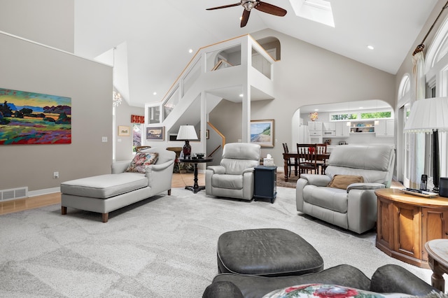 7843 Shepherds Glen Ct, Kalamazoo, MI 49009 - living area with high vaulted ceiling, ceiling fan, a skylight, arched walkways, and recessed lighting