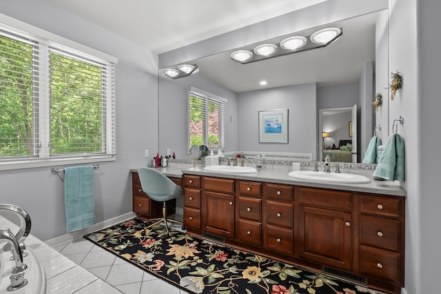 7843 Shepherds Glen Ct, Kalamazoo, MI 49009 - ensuite bathroom featuring double vanity, tile patterned flooring, baseboards, and a tub to relax in