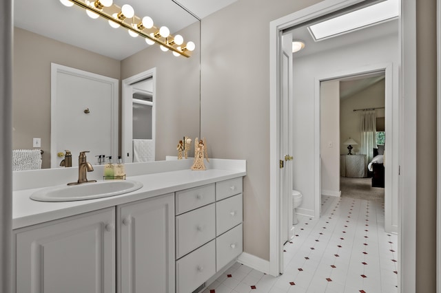 7843 Shepherds Glen Ct, Kalamazoo, MI 49009 - ensuite bathroom featuring toilet, vanity, baseboards, and tile patterned flooring