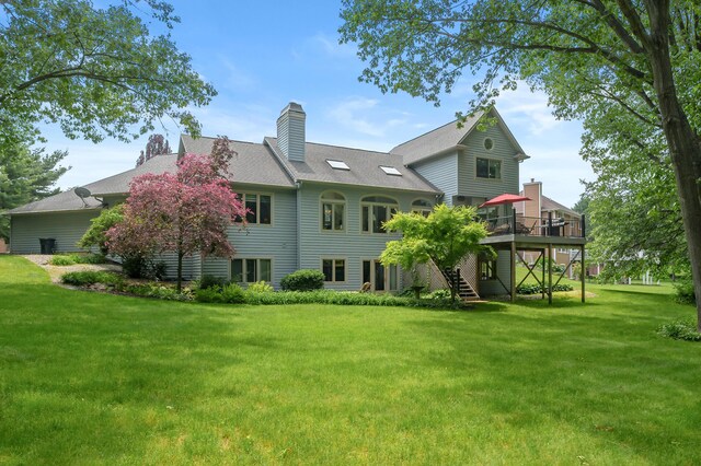 7843 Shepherds Glen Ct, Kalamazoo, MI 49009 - back of property with a deck, a chimney, a yard, and stairway