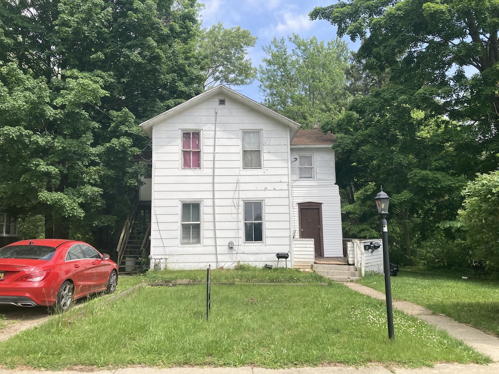 55 Poplar St, Battle Creek, MI 49017 - view of front of home featuring a front yard and stairway