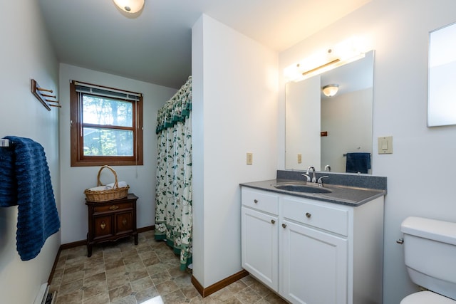 3715 Glen Haven Rd, Saint Joseph, MI 49085 - bathroom featuring toilet, stone finish flooring, vanity, and baseboards