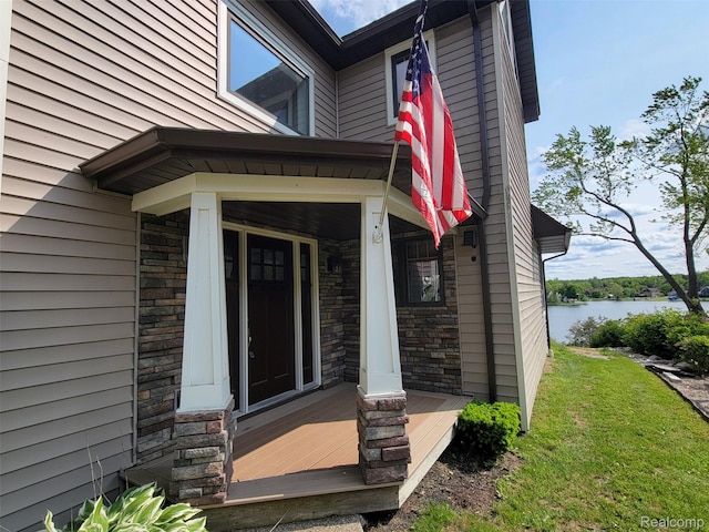 9635 Norman Rd, Clarkston, MI 48348 - doorway to property featuring stone siding and a water view