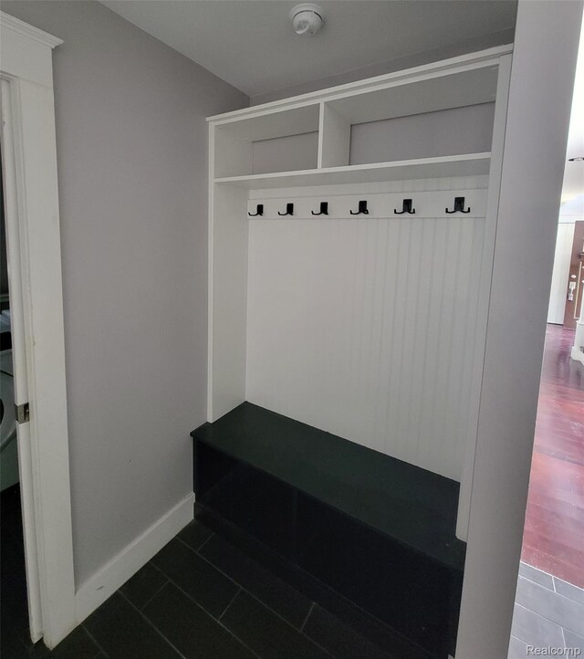 9635 Norman Rd, Clarkston, MI 48348 - mudroom with dark tile patterned flooring and baseboards
