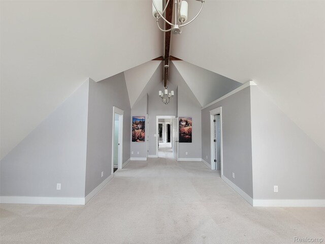 9635 Norman Rd, Clarkston, MI 48348 - unfurnished living room with a chandelier, lofted ceiling, baseboards, and light colored carpet
