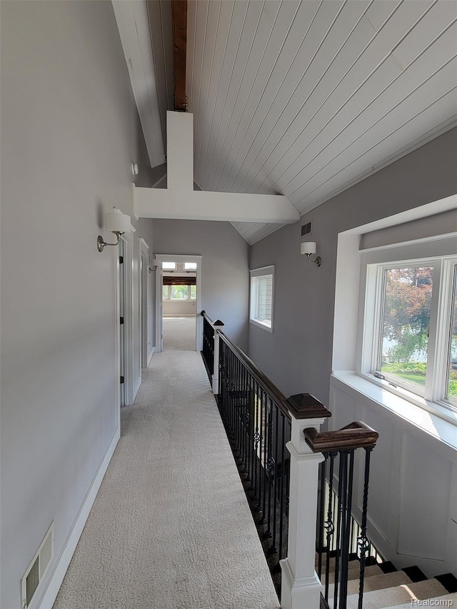 9635 Norman Rd, Clarkston, MI 48348 - corridor featuring light colored carpet, an upstairs landing, wooden ceiling, and baseboards