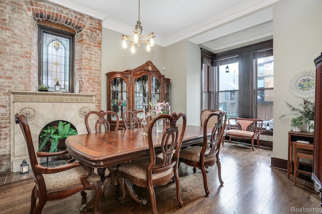 205 Alfred St Unit A, Detroit, MI 48201 - dining space with a chandelier, wood finished floors, crown molding, and baseboards