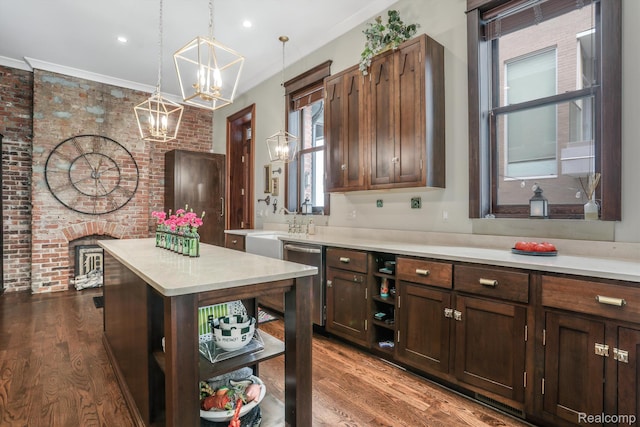 205 Alfred St Unit A, Detroit, MI 48201 - kitchen featuring open shelves, a chandelier, light countertops, dark wood-style floors, and brick wall