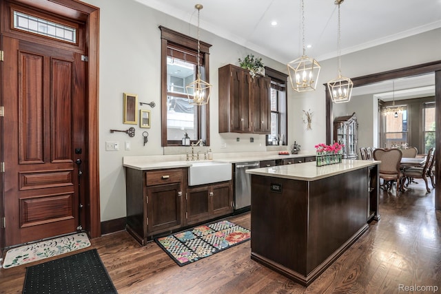 205 Alfred St Unit A, Detroit, MI 48201 - kitchen featuring a chandelier, dishwasher, light countertops, plenty of natural light, and crown molding