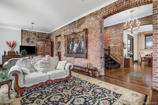 205 Alfred St Unit A, Detroit, MI 48201 - living area with a chandelier, wood finished floors, brick wall, and crown molding