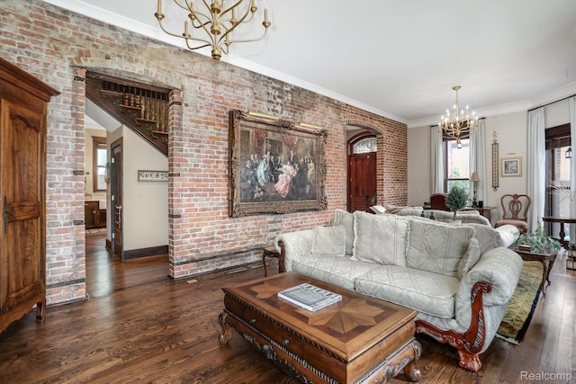 205 Alfred St Unit A, Detroit, MI 48201 - living area with a chandelier, brick wall, dark wood-style floors, and crown molding