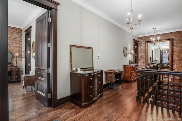 205 Alfred St Unit A, Detroit, MI 48201 - hall with brick wall, dark wood-style floors, a chandelier, crown molding, and baseboards