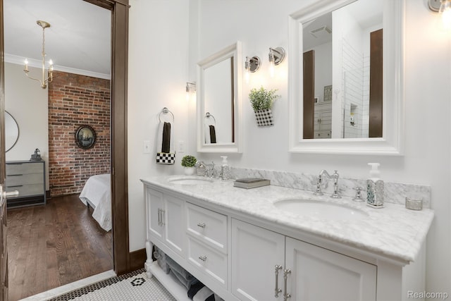 205 Alfred St Unit A, Detroit, MI 48201 - full bath with double vanity, brick wall, and ornamental molding