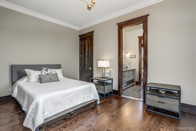 205 Alfred St Unit A, Detroit, MI 48201 - bedroom with ornamental molding, wood finished floors, ensuite bath, and baseboards