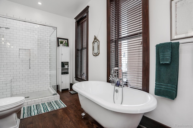 205 Alfred St Unit A, Detroit, MI 48201 - bathroom featuring a stall shower, a freestanding bath, wood finished floors, toilet, and recessed lighting