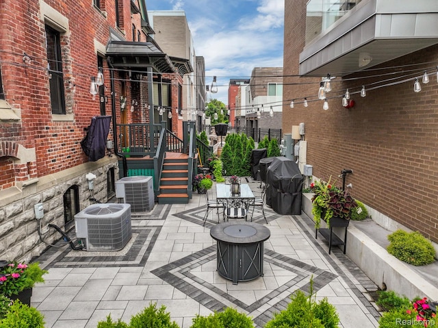 205 Alfred St Unit A, Detroit, MI 48201 - view of patio / terrace with central AC, outdoor dining space, and area for grilling