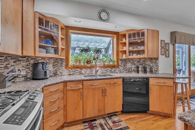 6676 Ralaric Dr, Dexter, MI 48130 - kitchen with black dishwasher, gas stove, open shelves, light wood-type flooring, and light stone countertops