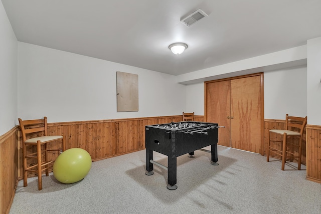 6676 Ralaric Dr, Dexter, MI 48130 - rec room with a wainscoted wall, wooden walls, and carpet floors