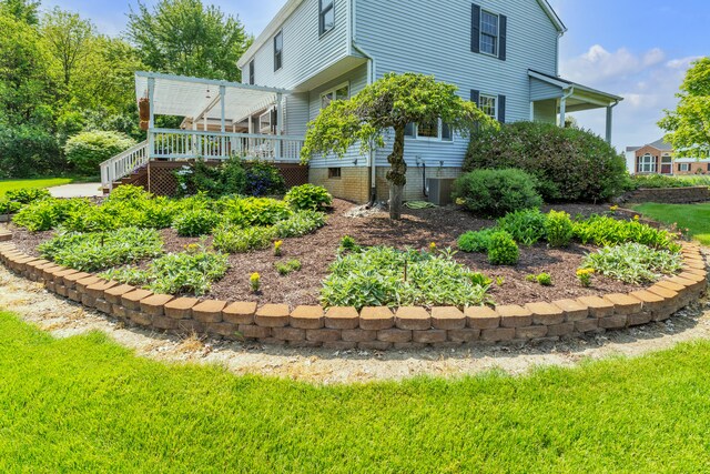6676 Ralaric Dr, Dexter, MI 48130 - view of side of home featuring a wooden deck and a yard