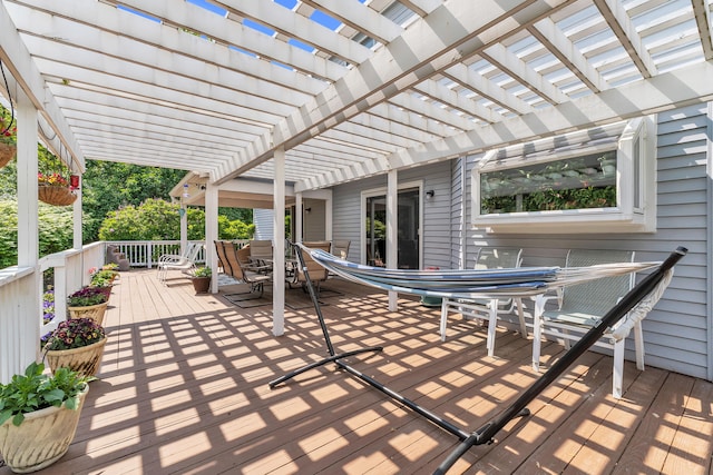 6676 Ralaric Dr, Dexter, MI 48130 - wooden deck with outdoor dining space and a pergola