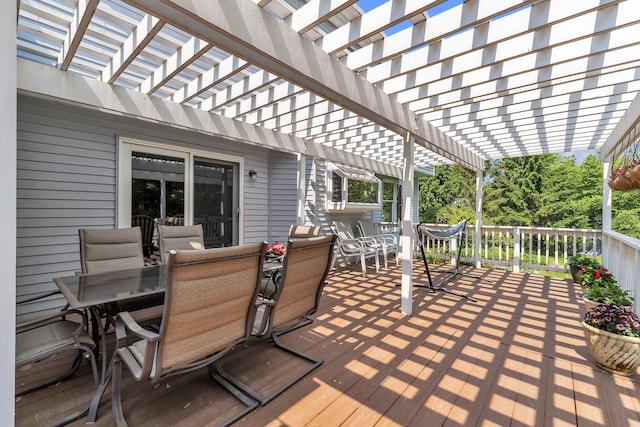 6676 Ralaric Dr, Dexter, MI 48130 - wooden deck with outdoor dining space and a pergola