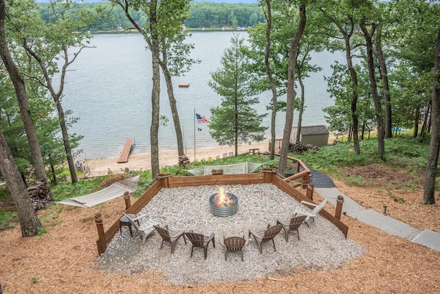 8833 W Velt Ave, Baldwin, MI 49304 - view of yard with an outdoor fire pit, a water view, and a garden