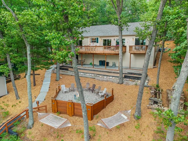 8833 W Velt Ave, Baldwin, MI 49304 - rear view of property featuring a wooden deck and a shingled roof