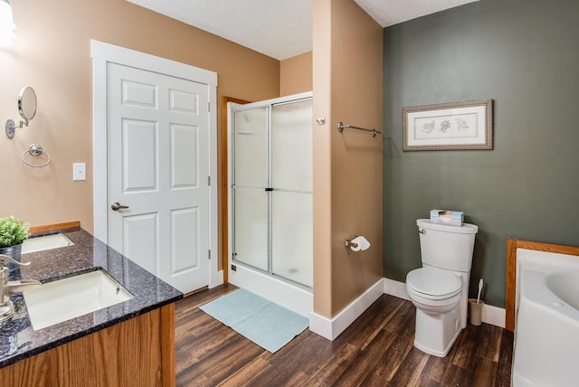 8833 W Velt Ave, Baldwin, MI 49304 - bathroom featuring wood finished floors, a shower stall, and baseboards