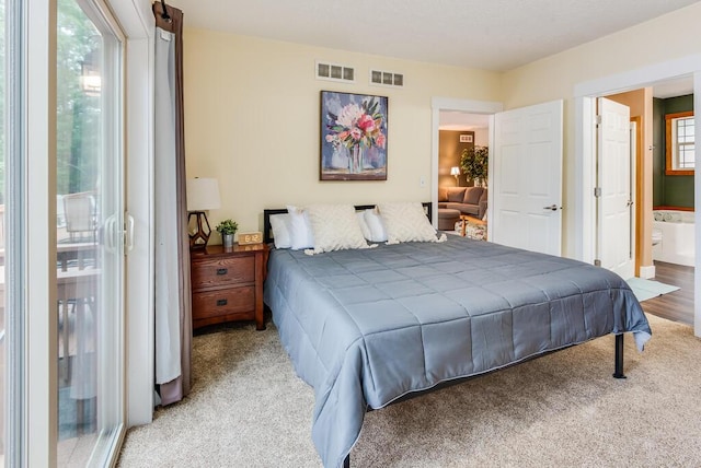 8833 W Velt Ave, Baldwin, MI 49304 - carpeted bedroom featuring connected bathroom