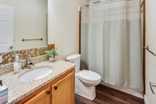 8833 W Velt Ave, Baldwin, MI 49304 - full bath featuring toilet, vanity, and wood finished floors