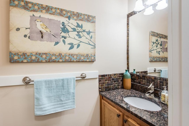 8833 W Velt Ave, Baldwin, MI 49304 - bathroom with vanity and decorative backsplash