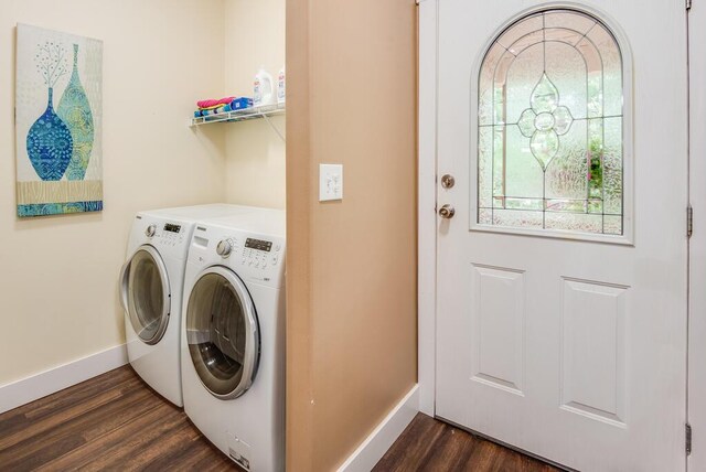 8833 W Velt Ave, Baldwin, MI 49304 - washroom with independent washer and dryer, baseboards, and dark wood-style floors