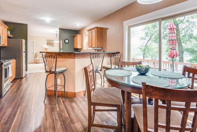 8833 W Velt Ave, Baldwin, MI 49304 - dining space with wood finished floors and baseboards