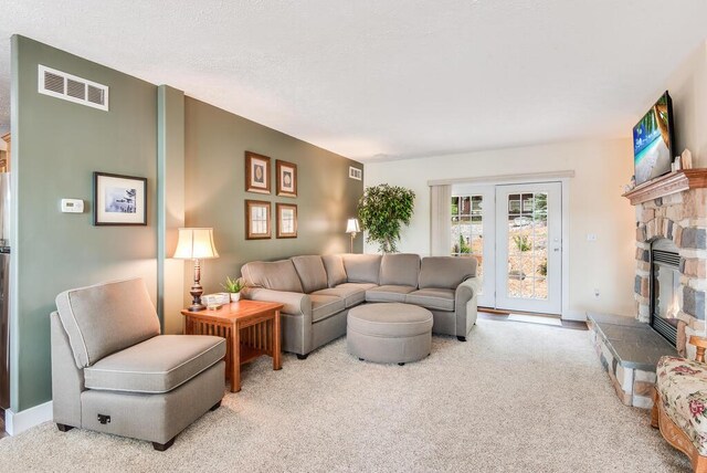 8833 W Velt Ave, Baldwin, MI 49304 - carpeted living area featuring a fireplace