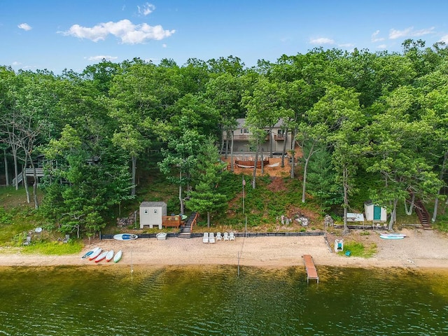 8833 W Velt Ave, Baldwin, MI 49304 - aerial view of property and surrounding area featuring a large body of water