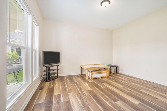 1162 Cooks Corner Ct SE, Byron Center, MI 49315 - spare room with wood finished floors and baseboards
