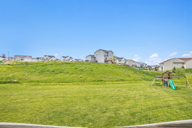 1162 Cooks Corner Ct SE, Byron Center, MI 49315 - view of grassy yard featuring a residential view and a playground